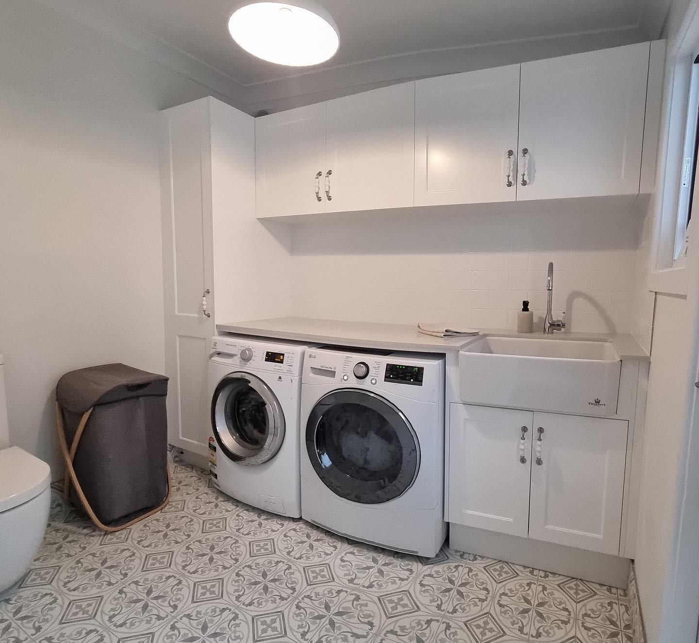 A Laundry Room With a Washer and Dryer and a Sink — The Kitchen Centre In Tuggerah, NSW