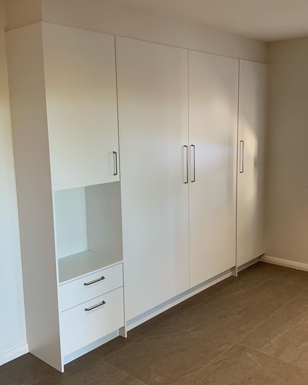 A Room With a Lot of White Cabinets and Drawers — The Kitchen Centre In Tuggerah, NSW