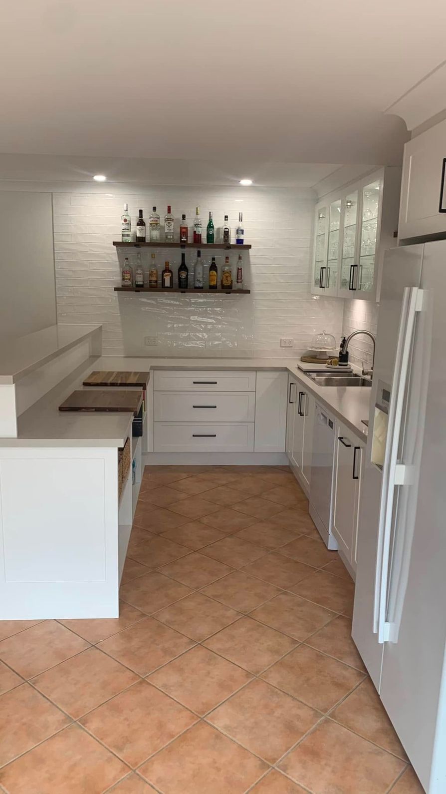 A Kitchen With White Cabinets and a Tiled Floor — The Kitchen Centre In Gosford, NSW
