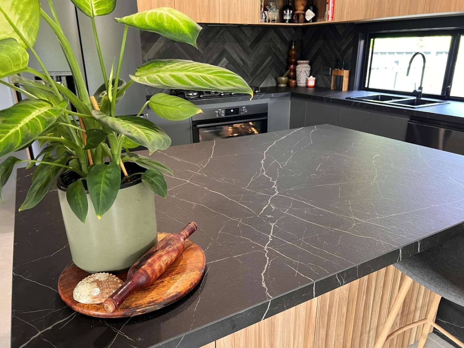 A Kitchen Counter With a Plant and a Plate of Food on It — The Kitchen Centre In Tuggerah, NSW