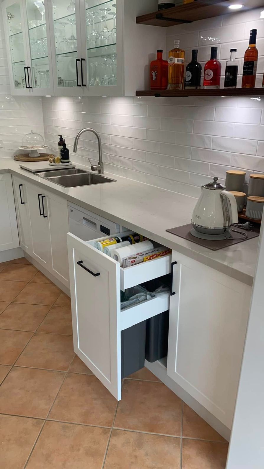 A Kitchen With White Cabinets, a Sink, and a Trash Can — The Kitchen Centre In Gosford, NSW