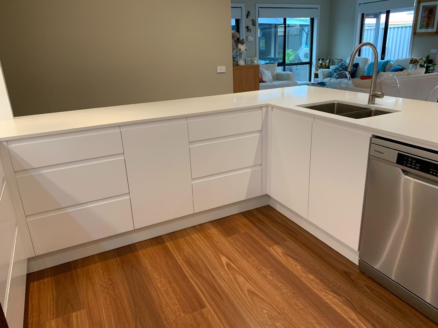 A Kitchen With White Cabinets, Stainless Steel Appliances, a Sink and a Dishwasher — The Kitchen Centre in Terrigal, NSW