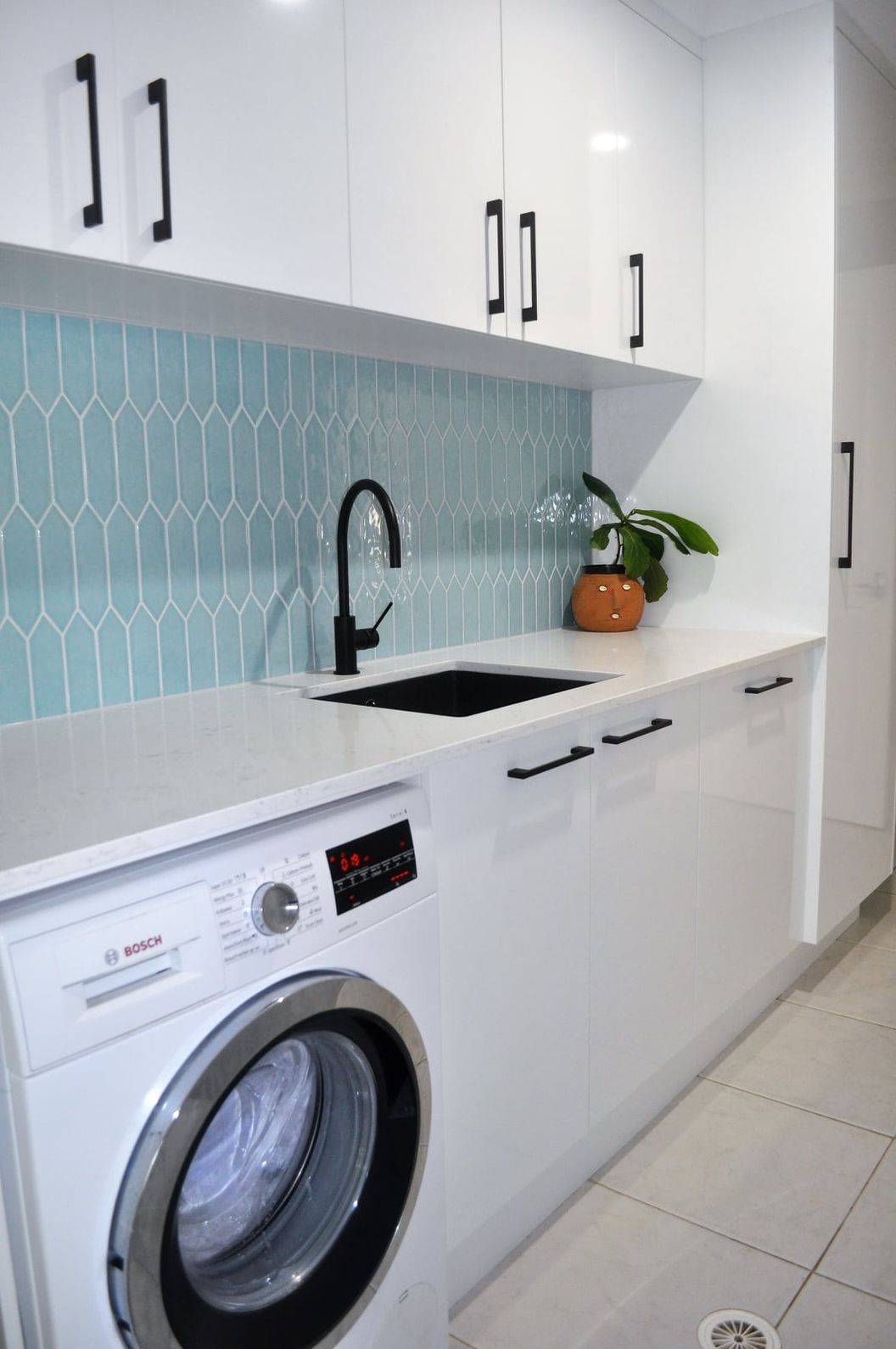 A Laundry Room With a Washer and Dryer and a Sink — The Kitchen Centre In Tuggerah, NSW