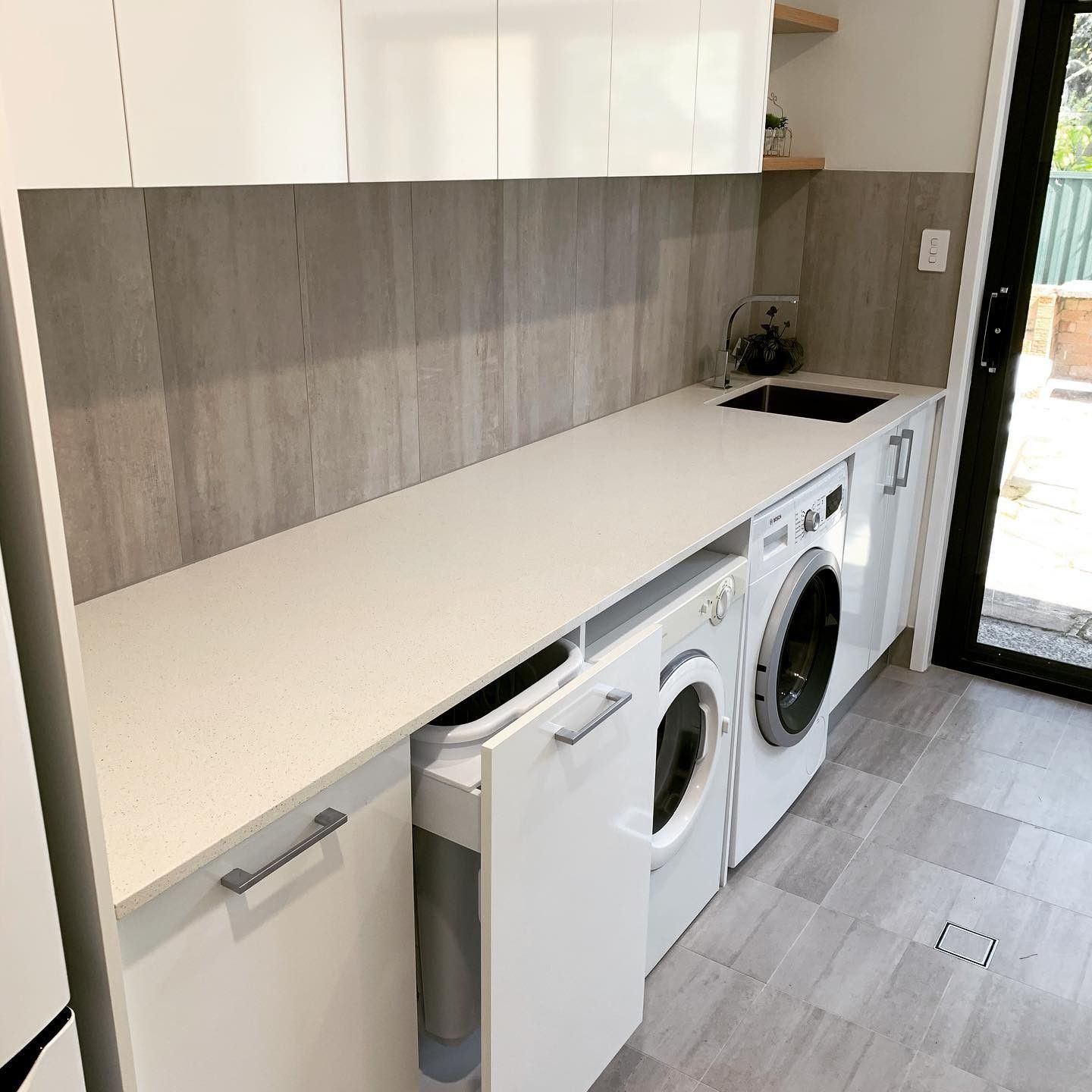 A Laundry Room With a Washer and Dryer and a Sink — The Kitchen Centre In Tuggerah, NSW