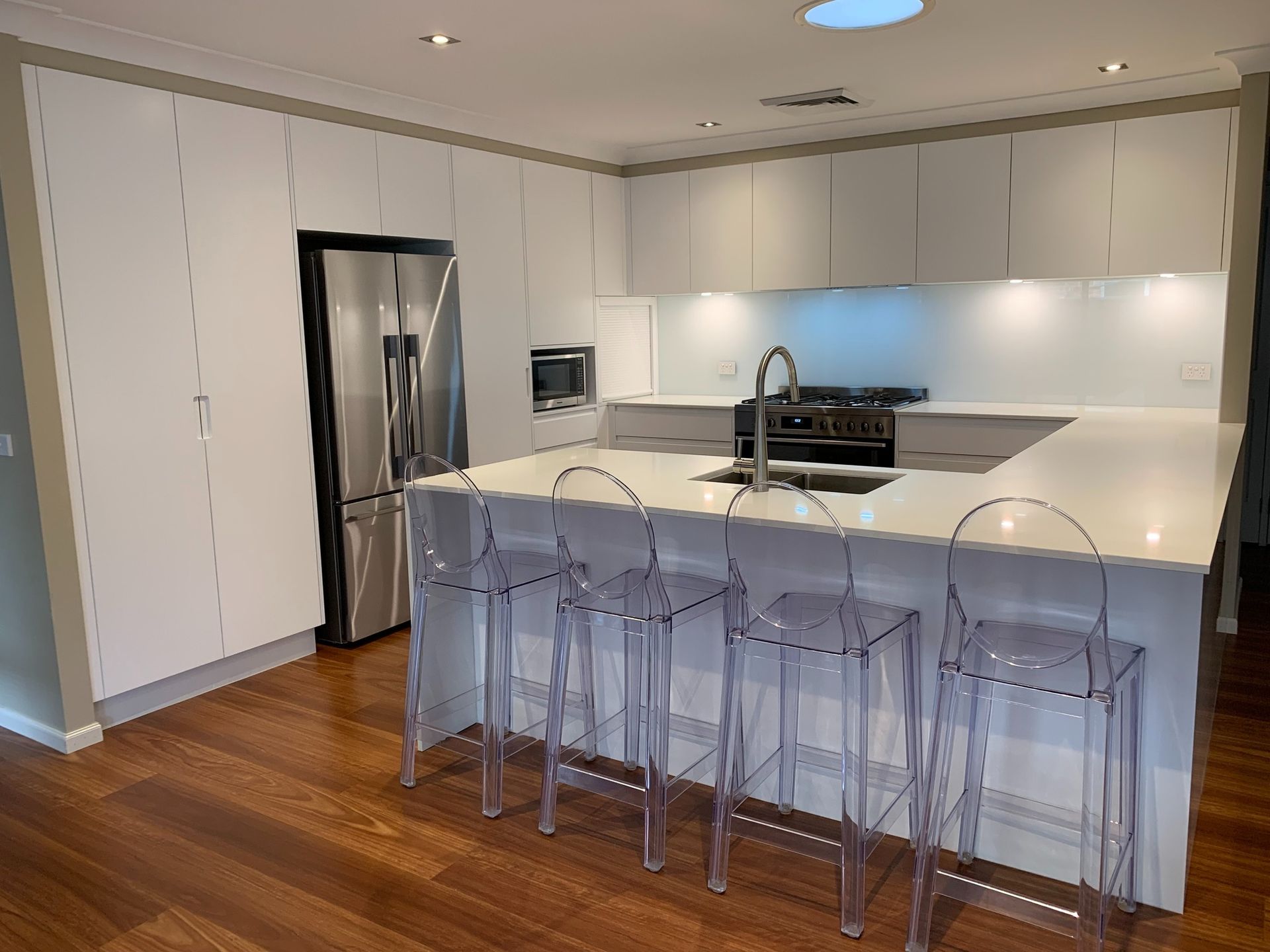 A Kitchen With a Grill, Sink, Table and Chairs — The Kitchen Centre In Tuggerah, NSW