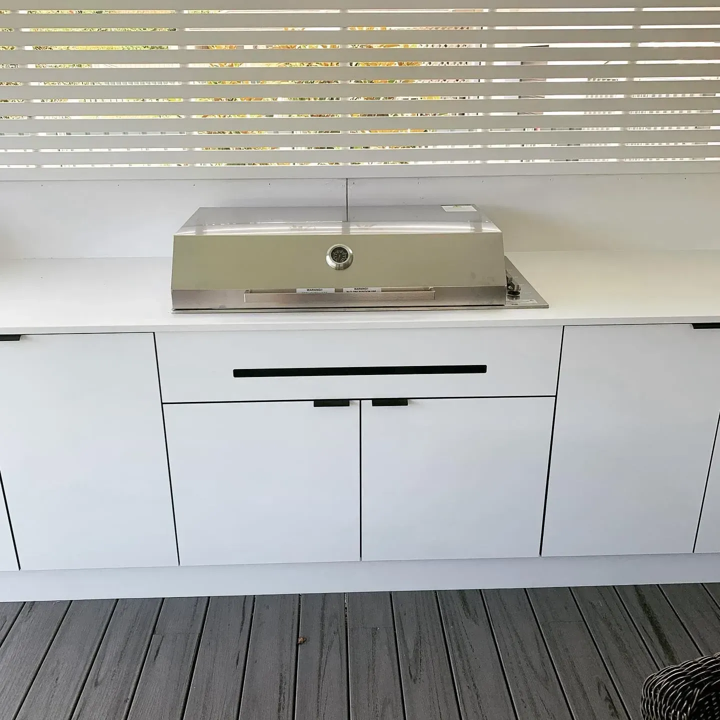 White Outdoor Kitchen With Stainless Steel Grill and Cabinets — The Kitchen Centre In Tuggerah, NSW