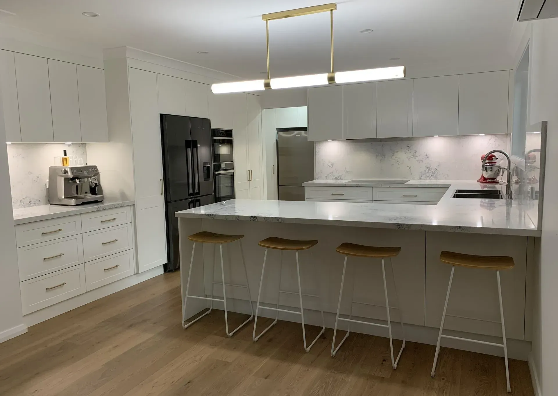 Modern White Kitchen With Marble Countertops, Island With Stools — The Kitchen Centre In Tuggerah, NSW