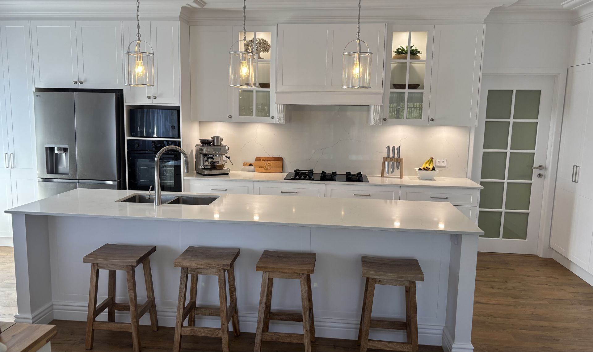 Modern White Kitchen With Island and Stools — The Kitchen Centre In Tuggerah, NSW
