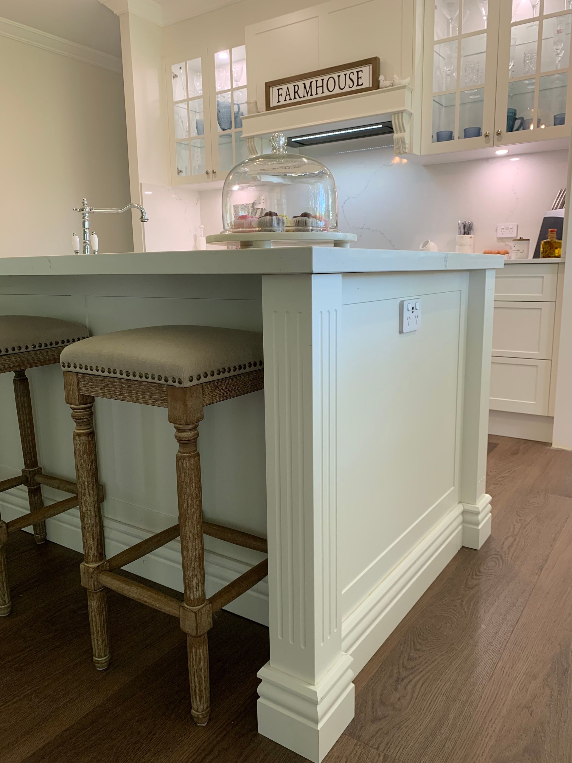 Green Kitchen With White Countertops, Stools, And Wooden Floors — The Kitchen Centre In Tuggerah, NSW