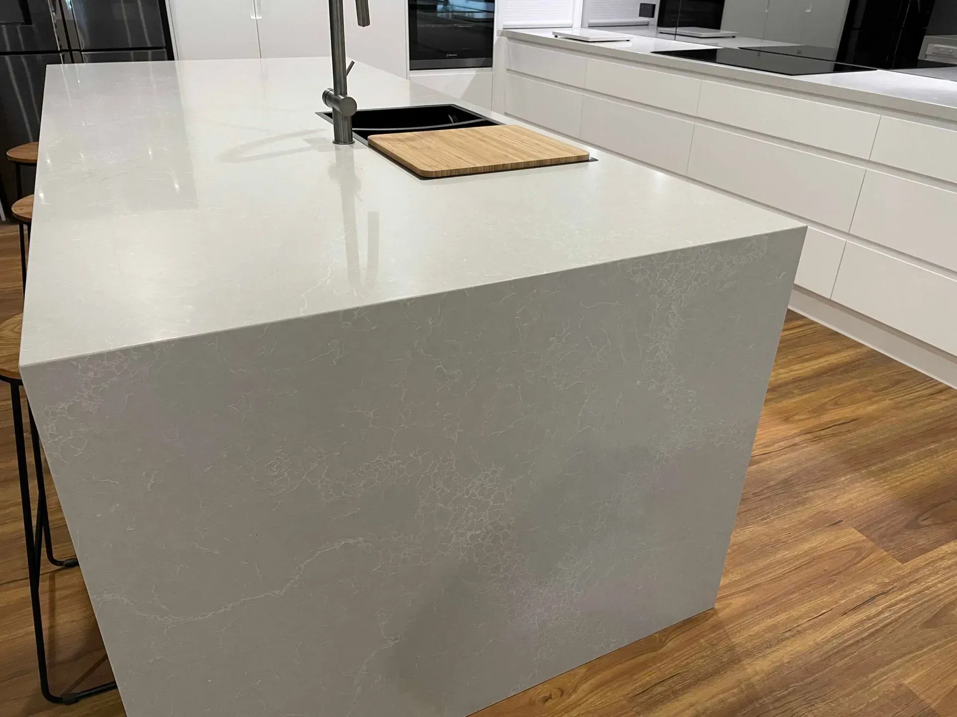 Kitchen Island With Light Gray Countertop and a Sink, Set on Wooden Floor — The Kitchen Centre In Tuggerah, NSW