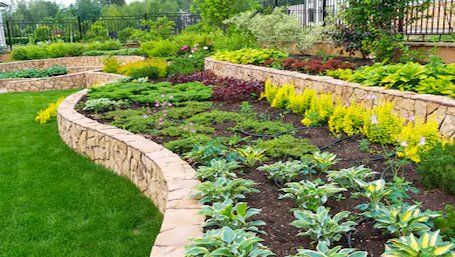 a raised garden bed landscaping with horticulturists choice of plants