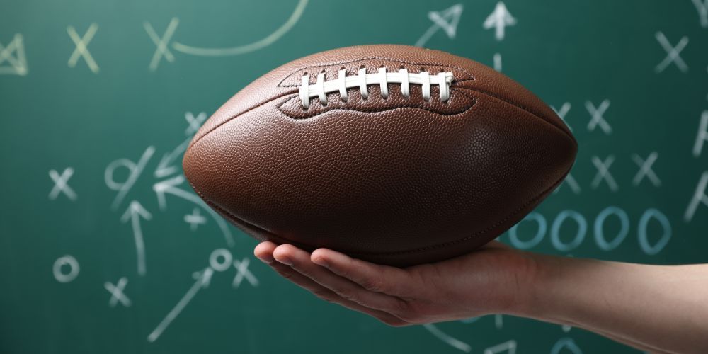 A chalkboard with a football strategy drawn on it