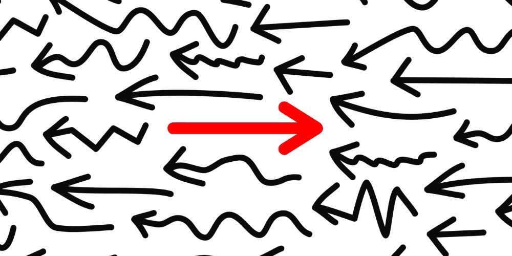 There is a red arrow pointing to the right in the middle of a bunch of black arrows.