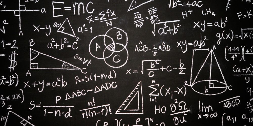 A blackboard with a lot of math equations on it