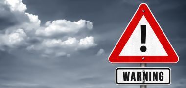 A red and white warning sign with an exclamation point on it