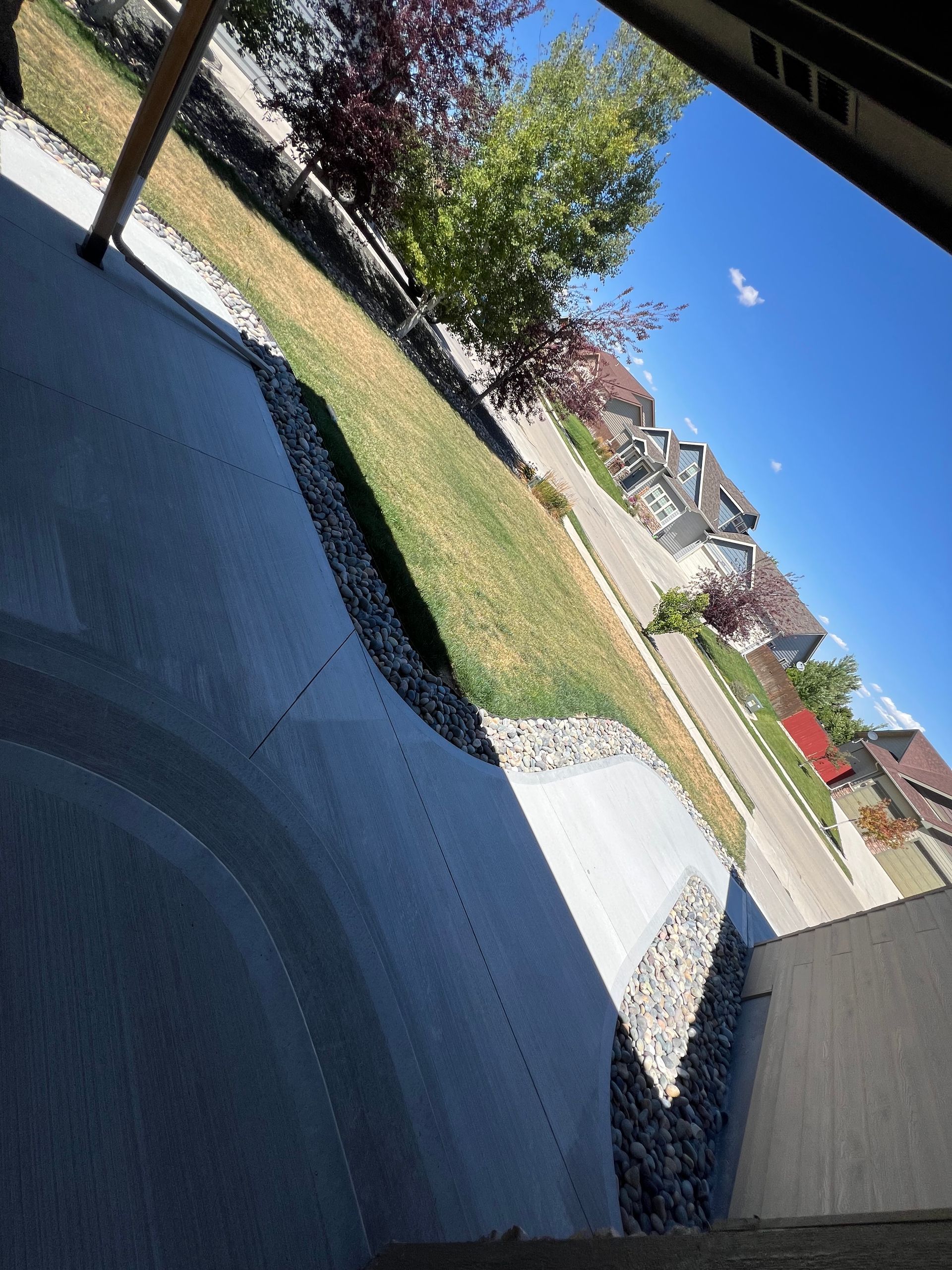 A view of a residential neighborhood from a porch.