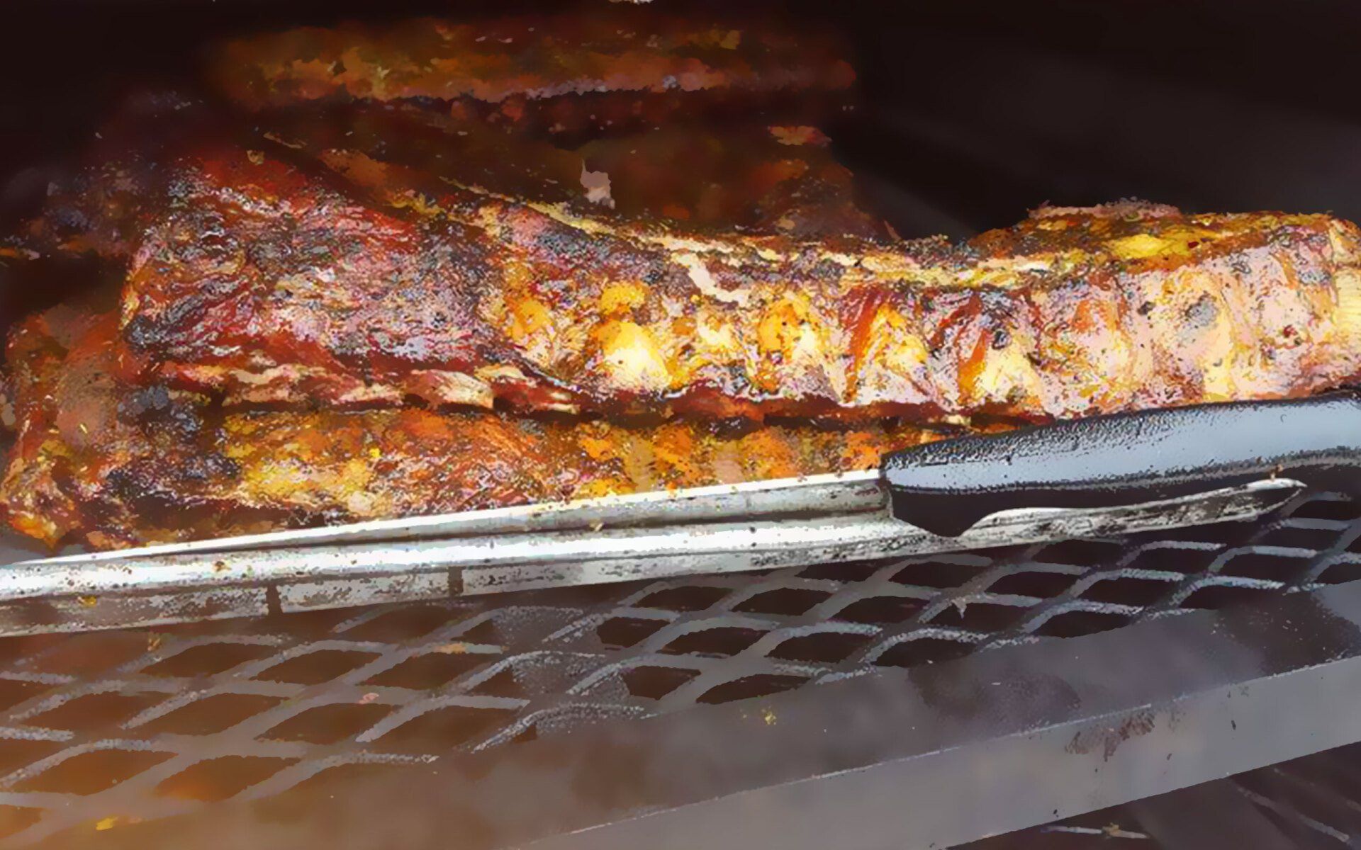 Ribs are being cooked on a grill with tongs