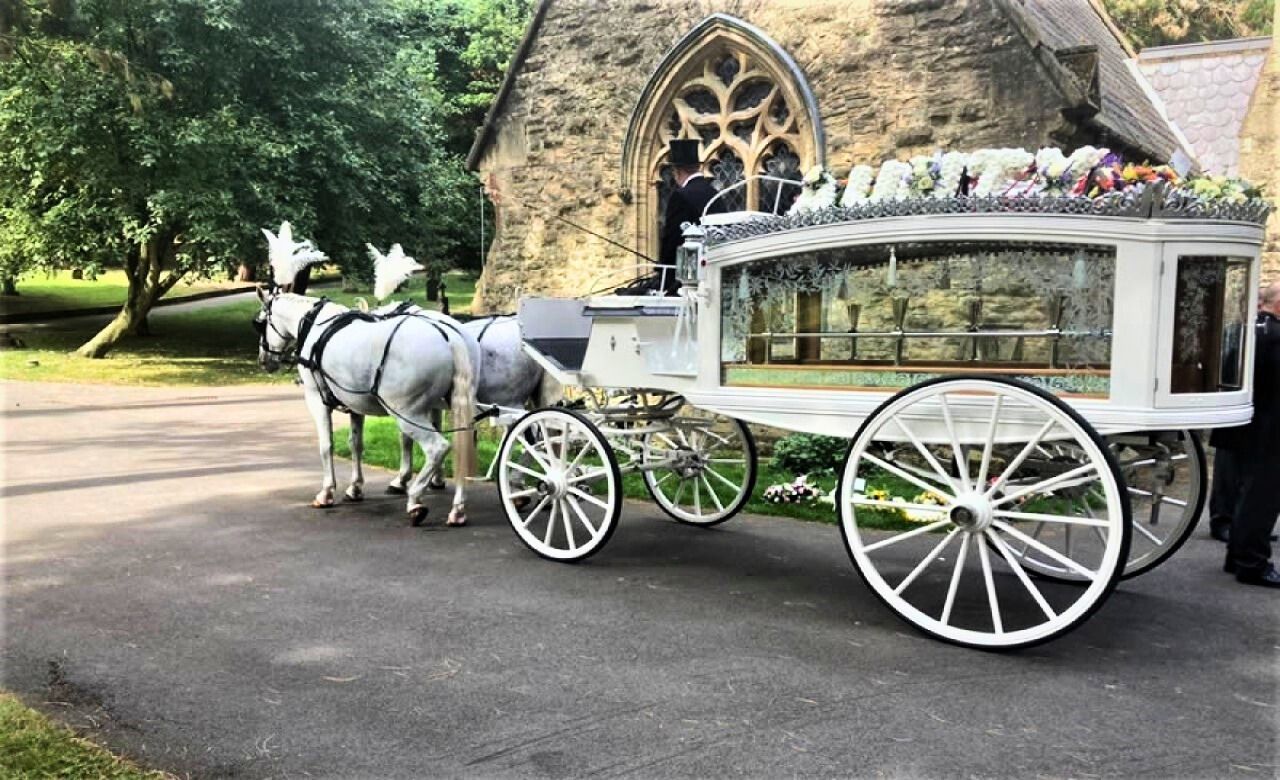 A large office building with a lot of windows on a sunny day.