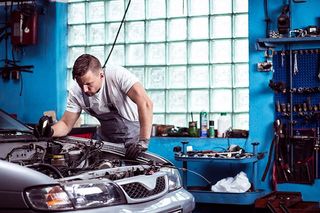Auto Repair — Mechanic Checking the Engine in Cornersville, TN