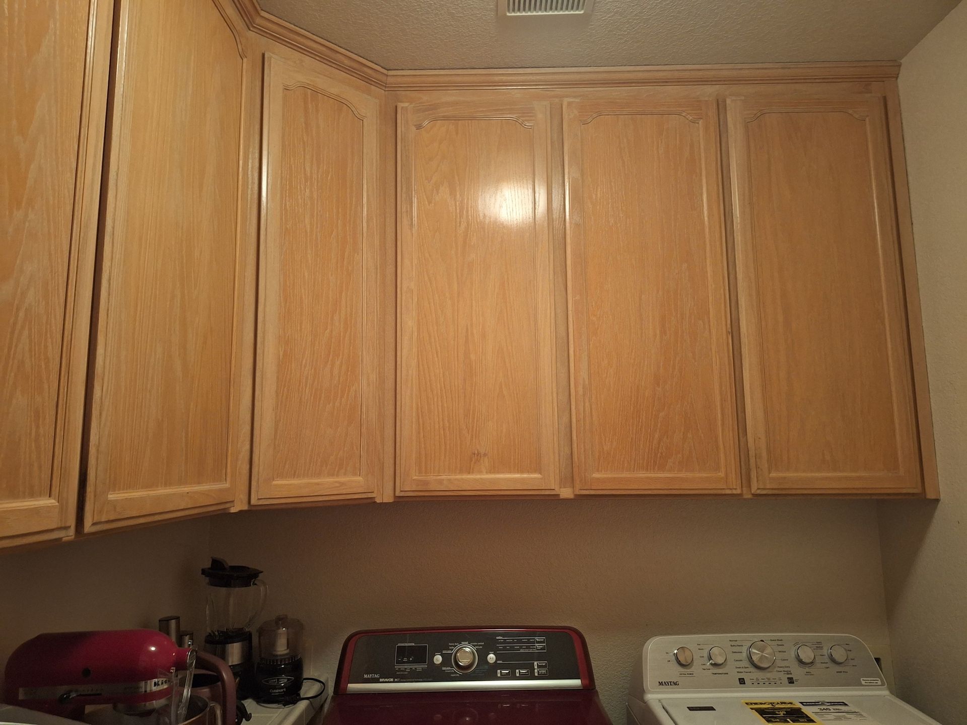 Before Laundry Room Cabinets Repainted