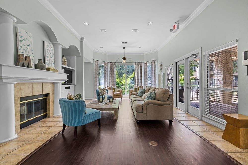 a living room filled with furniture and a fireplace at Marquis at Ladera Vista in Austin, TX.