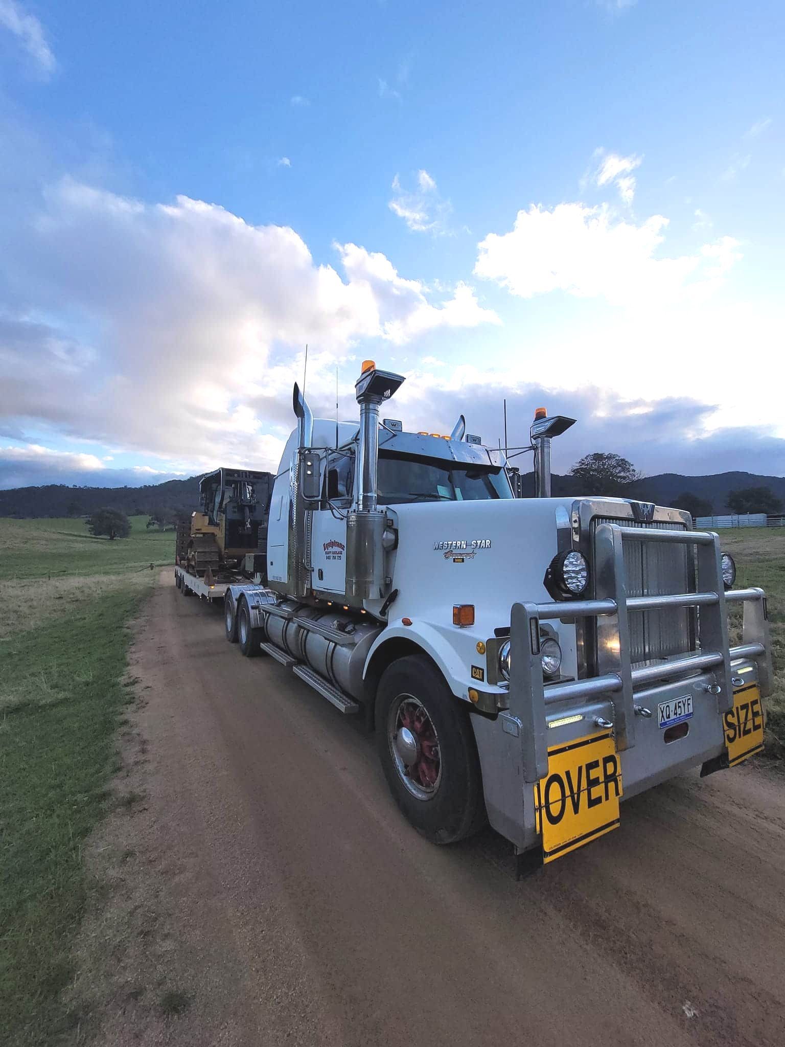 A White Semi Truck Is Parked On The Side Of A Dirt Road — Equiptranz In Kybong, QLD