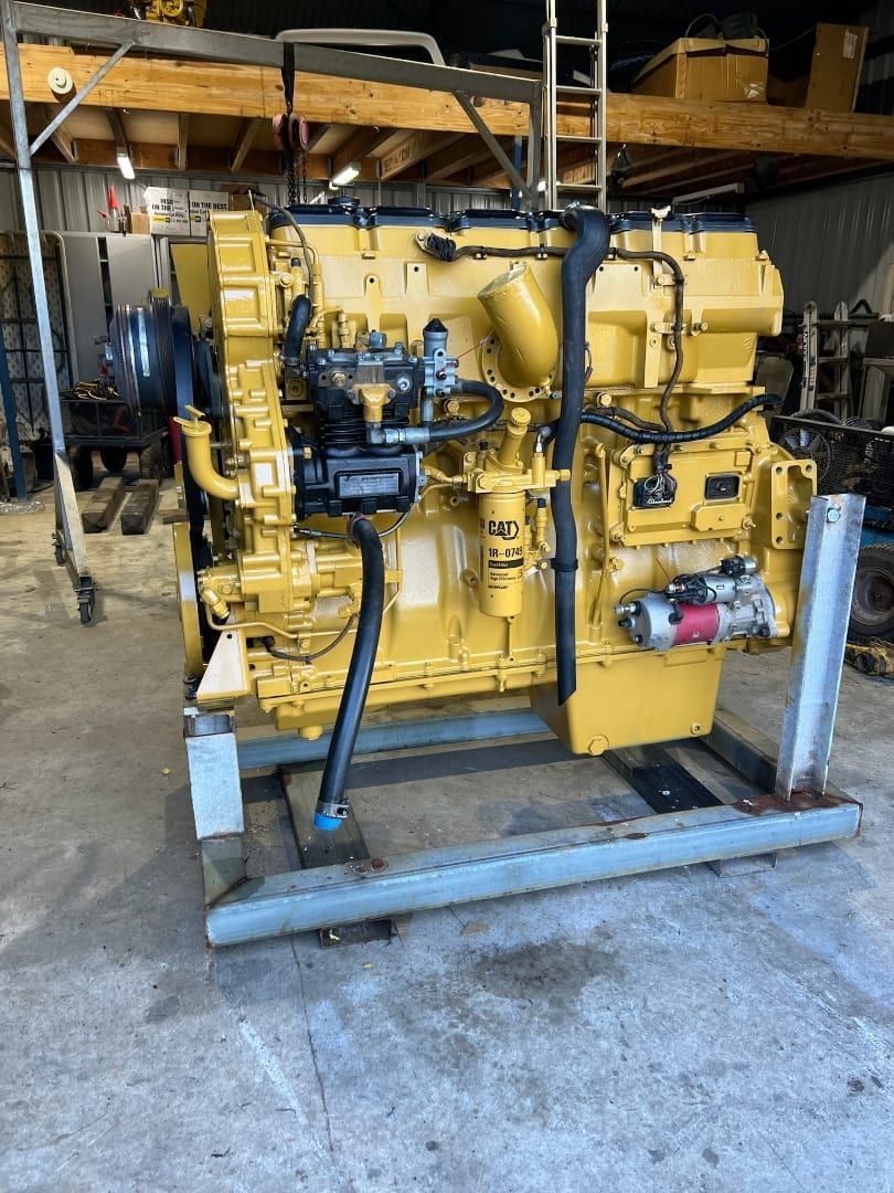 A Large Yellow Engine Is Sitting On A Rack In A Garage — Equiptranz In Kybong, QLD
