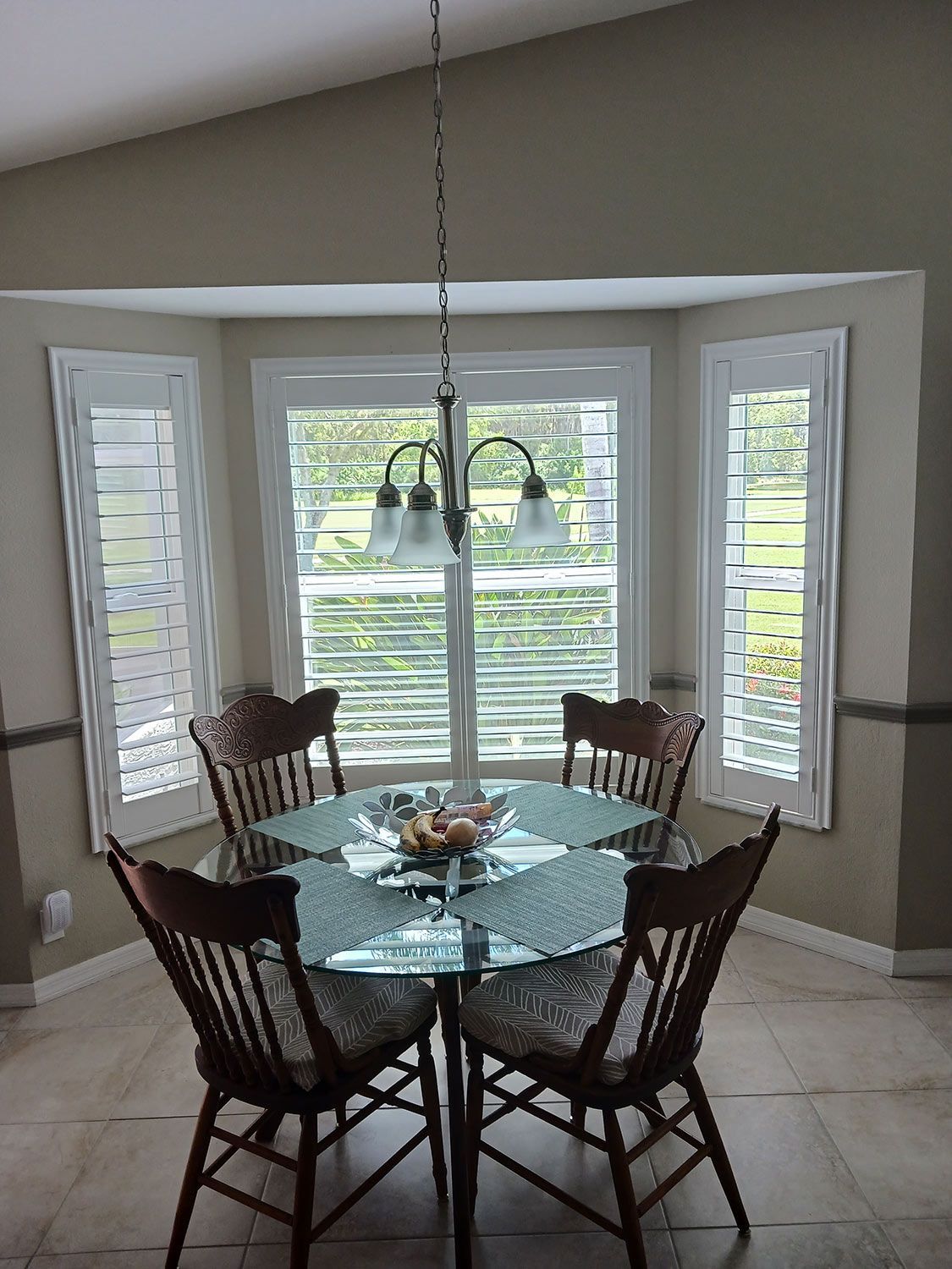 Bay windows with shutters in dining area
