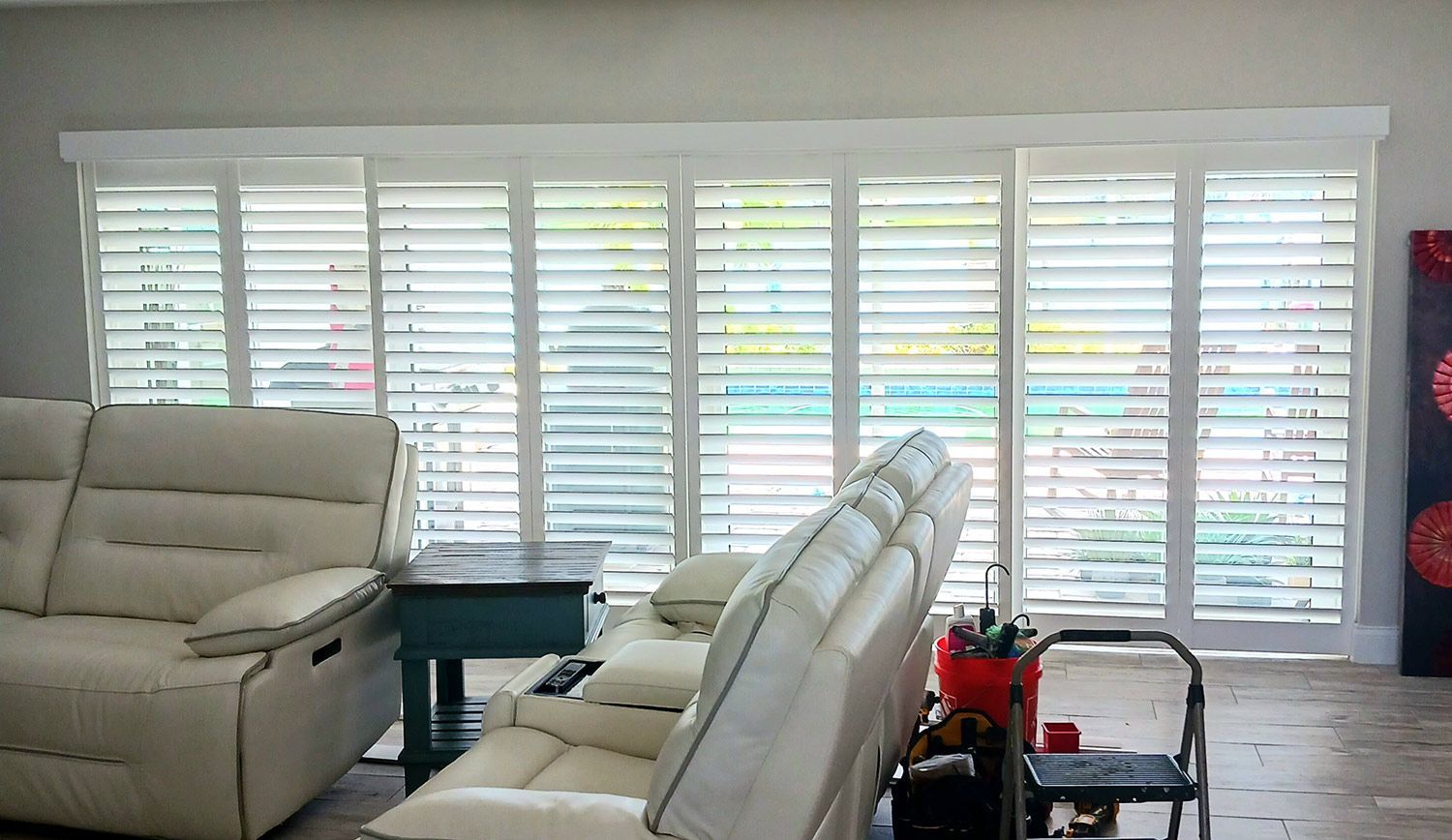 Living room interior with window shutters Living room interior with window shutters