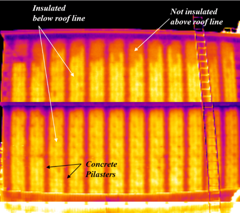 A thermal image of a roof showing insulated below roof line and not insulated above roof line
