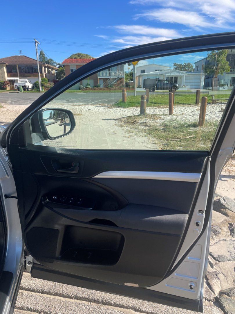 A Car is Parked on the Side of the Road With the Door Open — Pelican Motors Service Centre In Caloundra West, QLD 