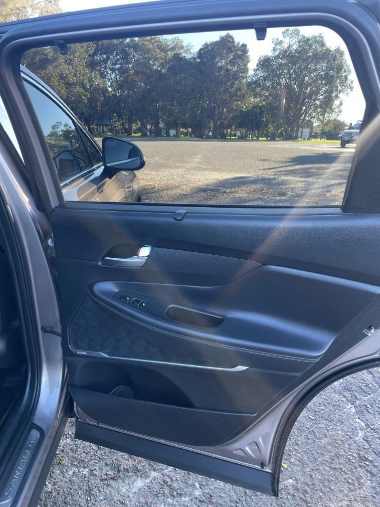 The Back Door of a Car is Open and the Window is Open — Pelican Motors Service Centre In Caloundra West, QLD 