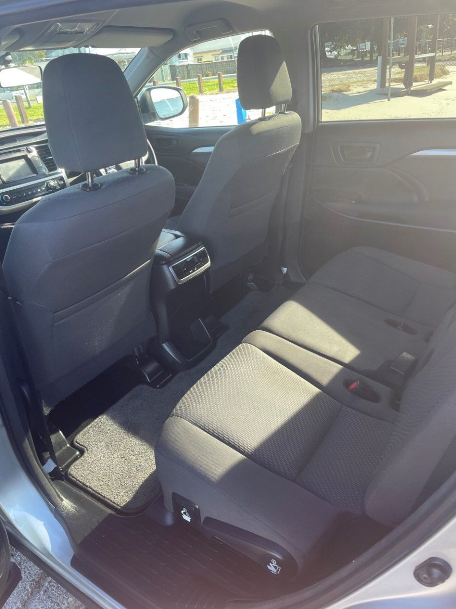 The Back Seat of a Car is Shown With the Door Open — Pelican Motors Service Centre In Caloundra West, QLD 