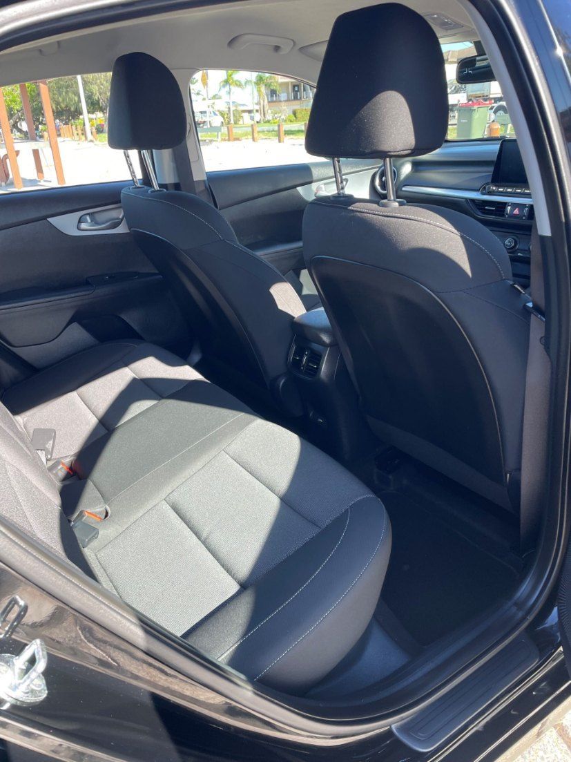 The Back Seat of a Black Car With the Door Open — Pelican Motors Service Centre In Caloundra West, QLD 