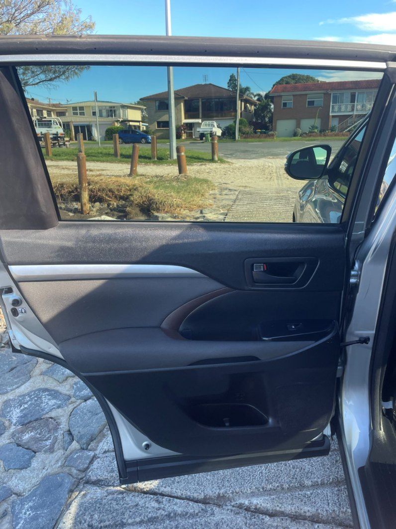 The Back Door of a Silver Car is Open and Looking Out the Window — Pelican Motors Service Centre In Caloundra West, QLD 
