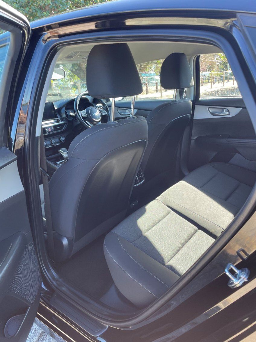 The Back Seat of a Black Car With the Door Open — Pelican Motors Service Centre In Caloundra West, QLD 