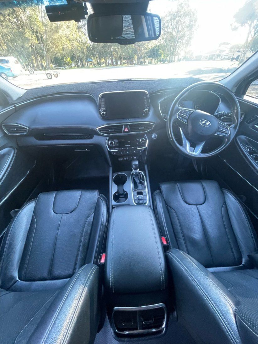 The Interior of a Black Car With Leather Seats and a Steering Wheel — Pelican Motors Service Centre In Caloundra West, QLD 