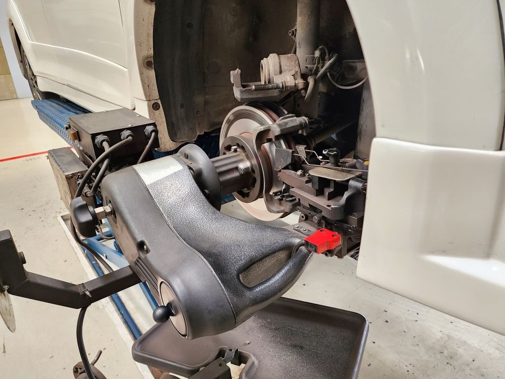 Wheel Balancing Machine on a Car's Front Wheel in a Garage — Pelican Motors Service Centre in Caloundra West, QLD