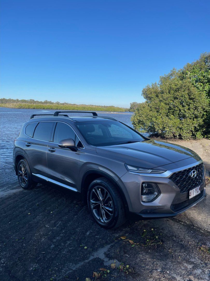 A Gray Suv is Parked Next to a Body of Water — Pelican Motors Service Centre In Caloundra West, QLD 