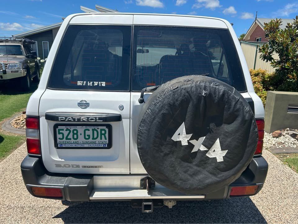 A White Nissan Patrol is Parked in a Driveway — Pelican Motors Service Centre In Caloundra West, QLD 