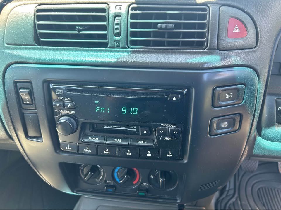 A Close Up of the Dashboard of a Car With a Radio — Pelican Motors Service Centre In Caloundra West, QLD 