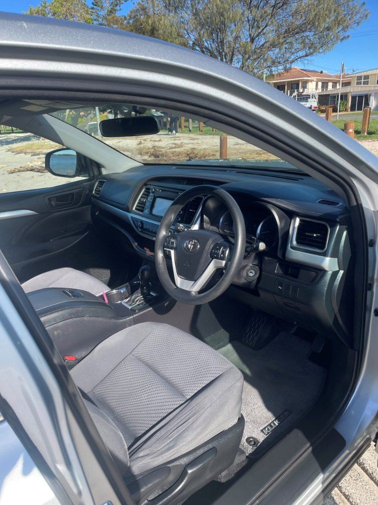 The Interior of a Silver Car With the Door Open and the Steering Wheel Visible — Pelican Motors Service Centre In Caloundra West, QLD 