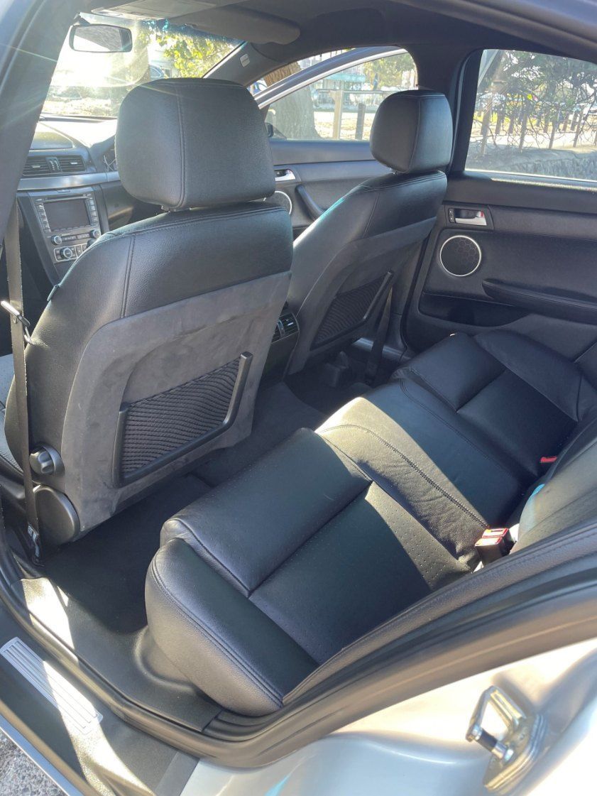 The Back Seat of a Silver Car With Black Leather Seats — Pelican Motors Service Centre In Caloundra West, QLD 