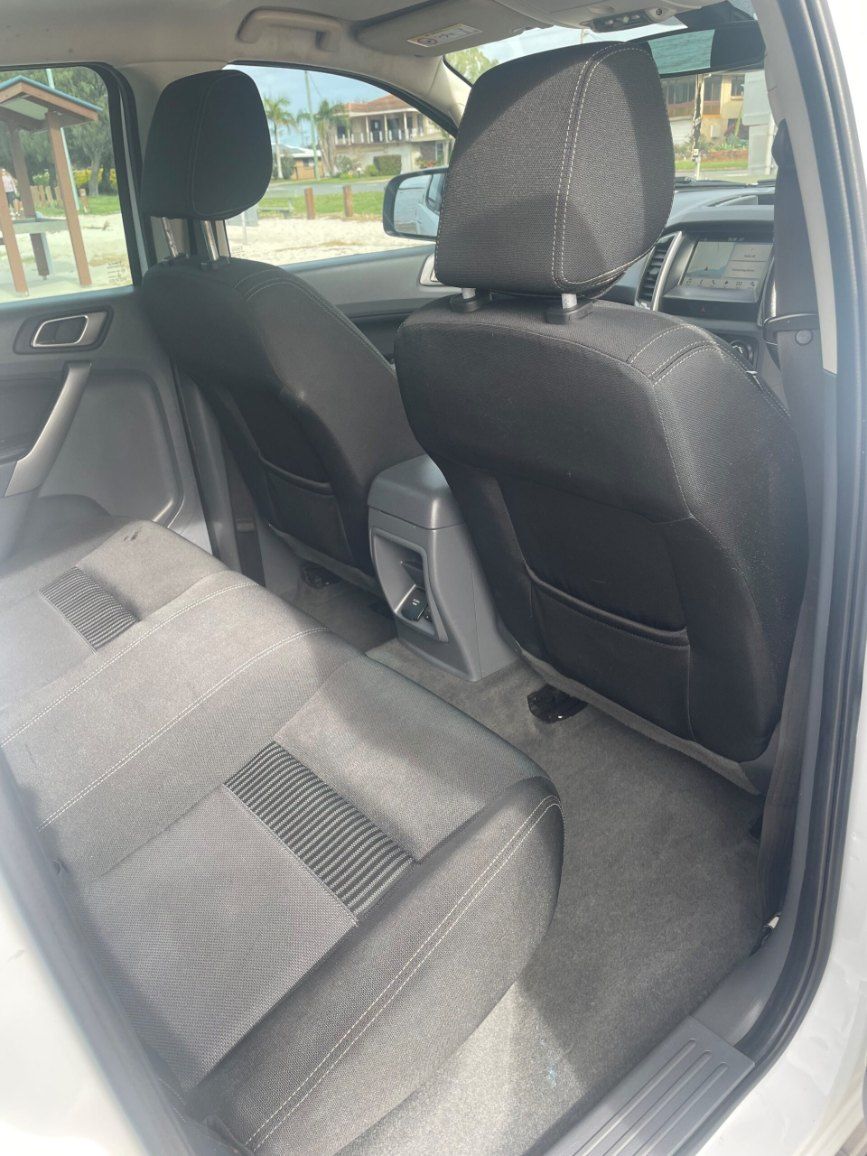 The Back Seat of a White Car With Black Seats — Pelican Motors Service Centre In Caloundra West, QLD 