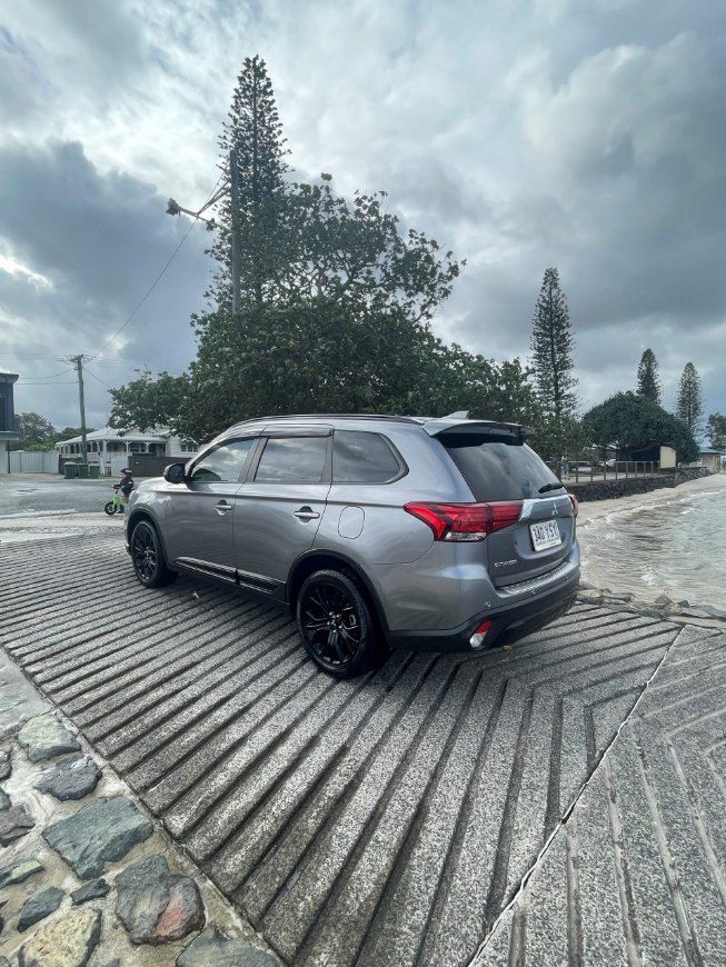 A Gray Suv is Parked on a Gravel Road — Pelican Motors Service Centre In Caloundra West, QLD 
