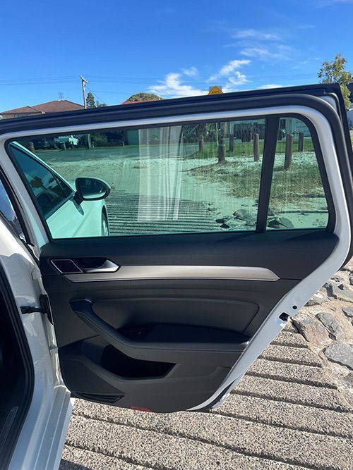 The Back Door of a White Car is Open — Pelican Motors Service Centre In Caloundra West, QLD 