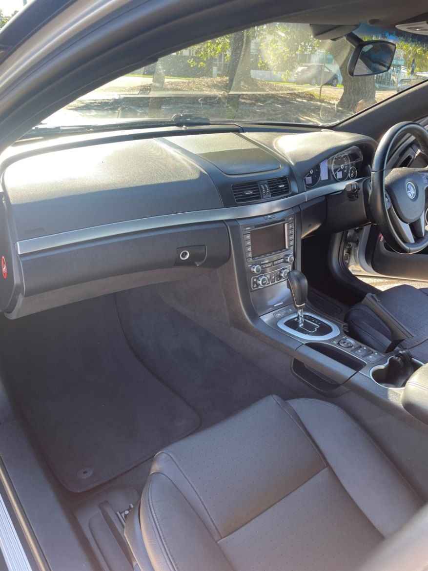 The Interior of a Car With a Steering Wheel and Dashboard — Pelican Motors Service Centre In Caloundra West, QLD 