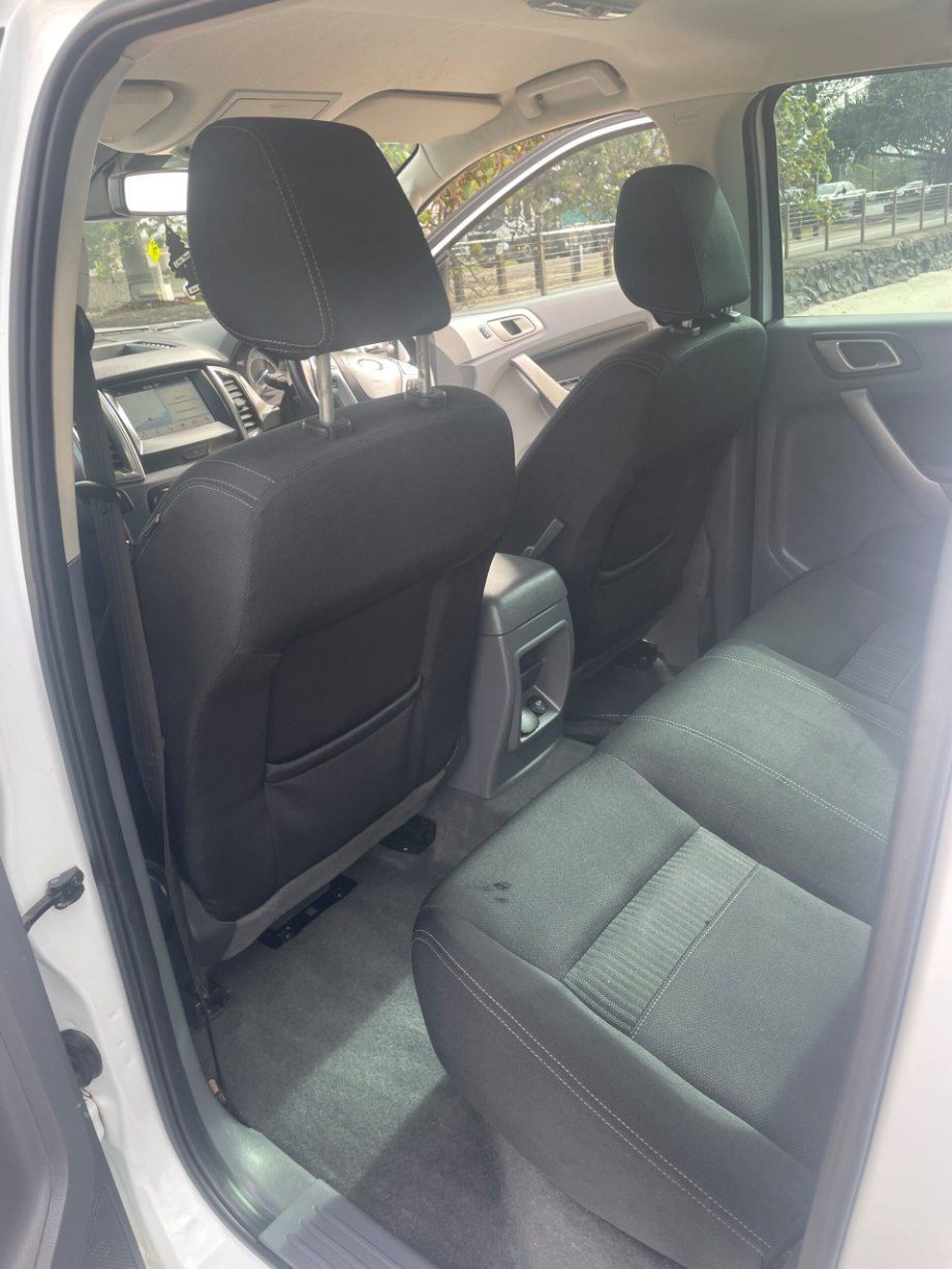 The Back Seat of a White Truck With Black Seats — Pelican Motors Service Centre In Caloundra West, QLD 