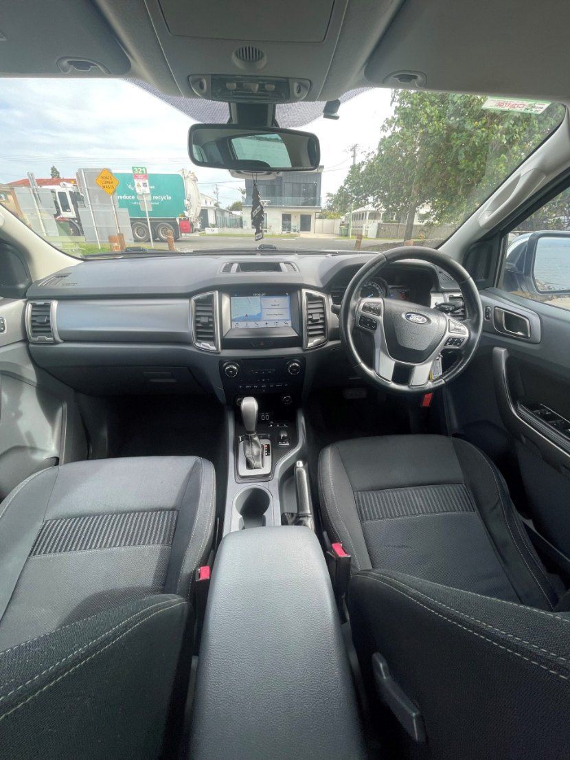 The Inside of a Car With a Steering Wheel and a Dashboard — Pelican Motors Service Centre In Caloundra West, QLD 