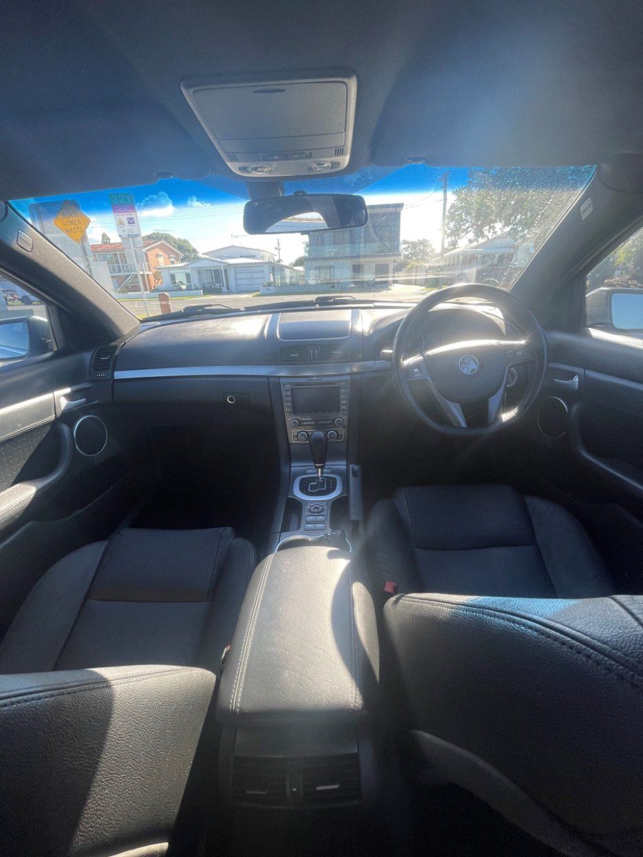 The Interior of a Black Car With Leather Seats and a Steering Wheel — Pelican Motors Service Centre In Caloundra West, QLD 